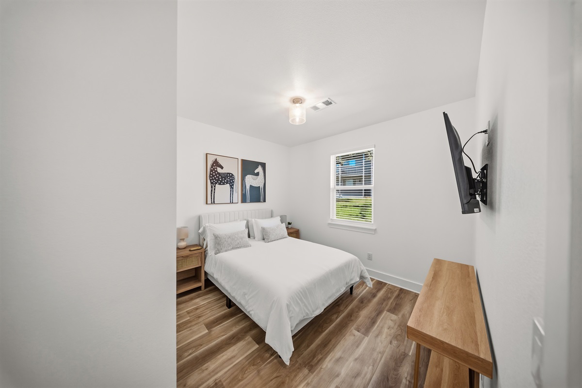Guest bedroom with queen bed and modern Texas styling