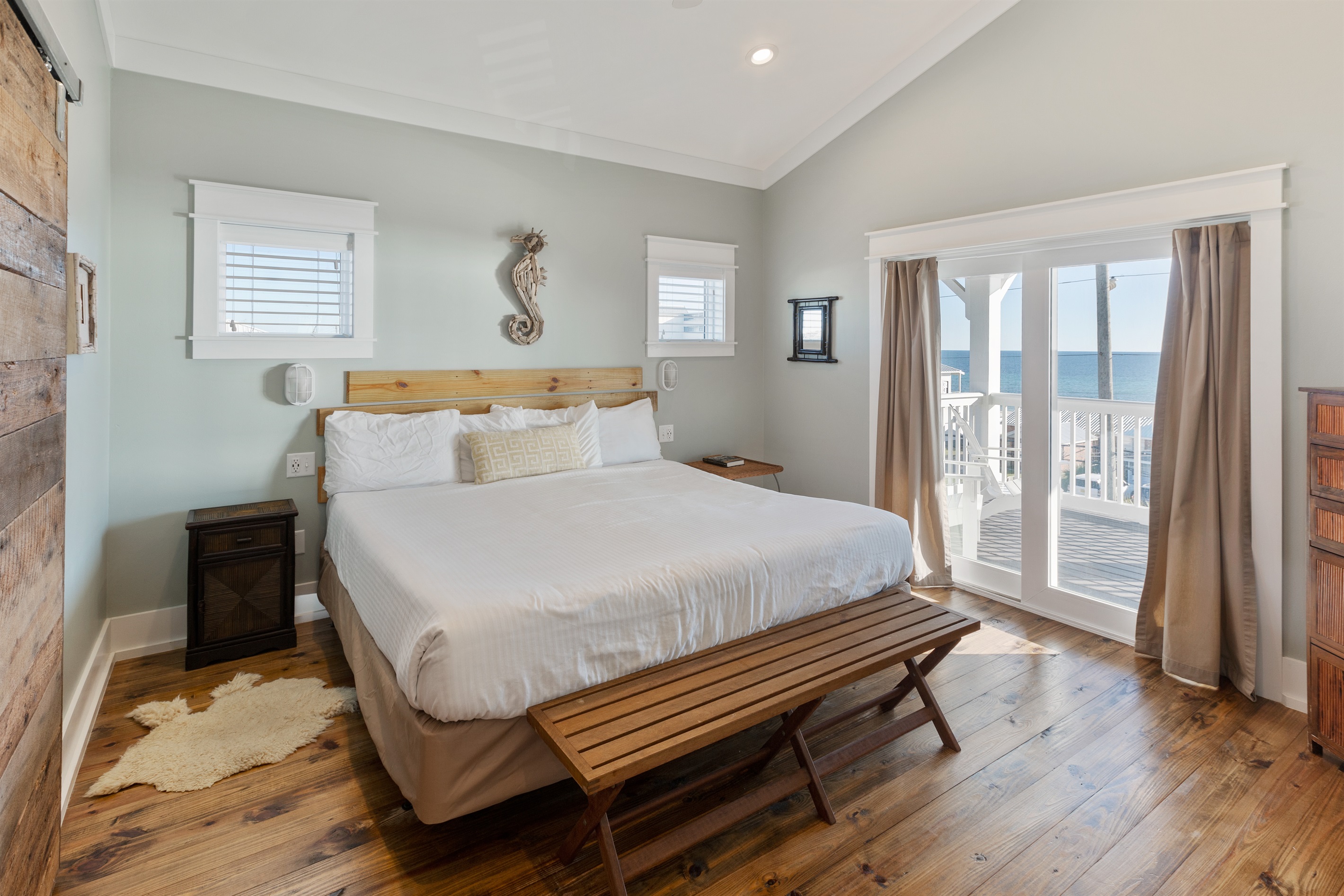Also known as the Seahorse suite, this room has a vaulted ceiling, commanding views of the Gulf, and a spa-like private bath with a custom-built reclaimed barnwood door. This room is generally claimed by the "Host" of the group!