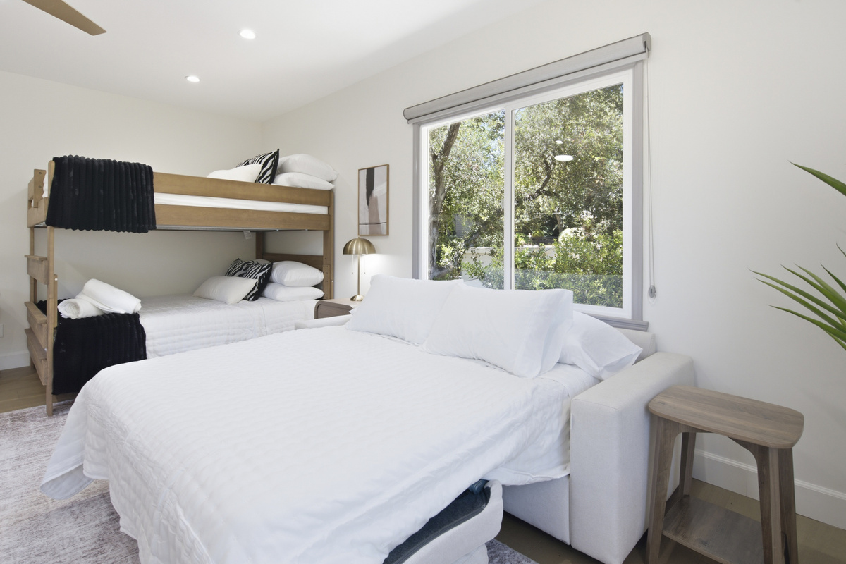Relax, recharge, and enjoy a peaceful stay in this beautifully appointed bedroom.