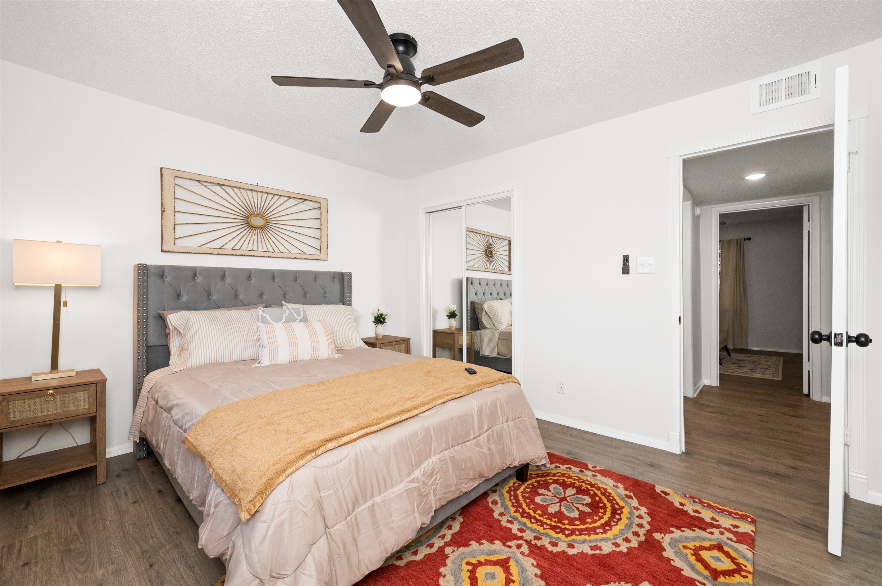 Front view: look at the cozy queen bedroom with luxe linens styled for comfort and restful sleep.
