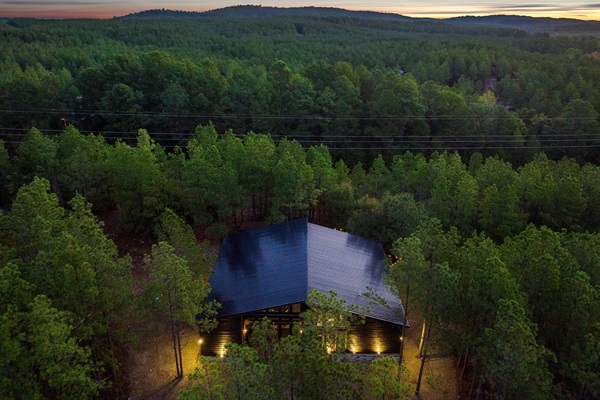 Peaceful woodland cabin with breathtaking mountain sunset scenery