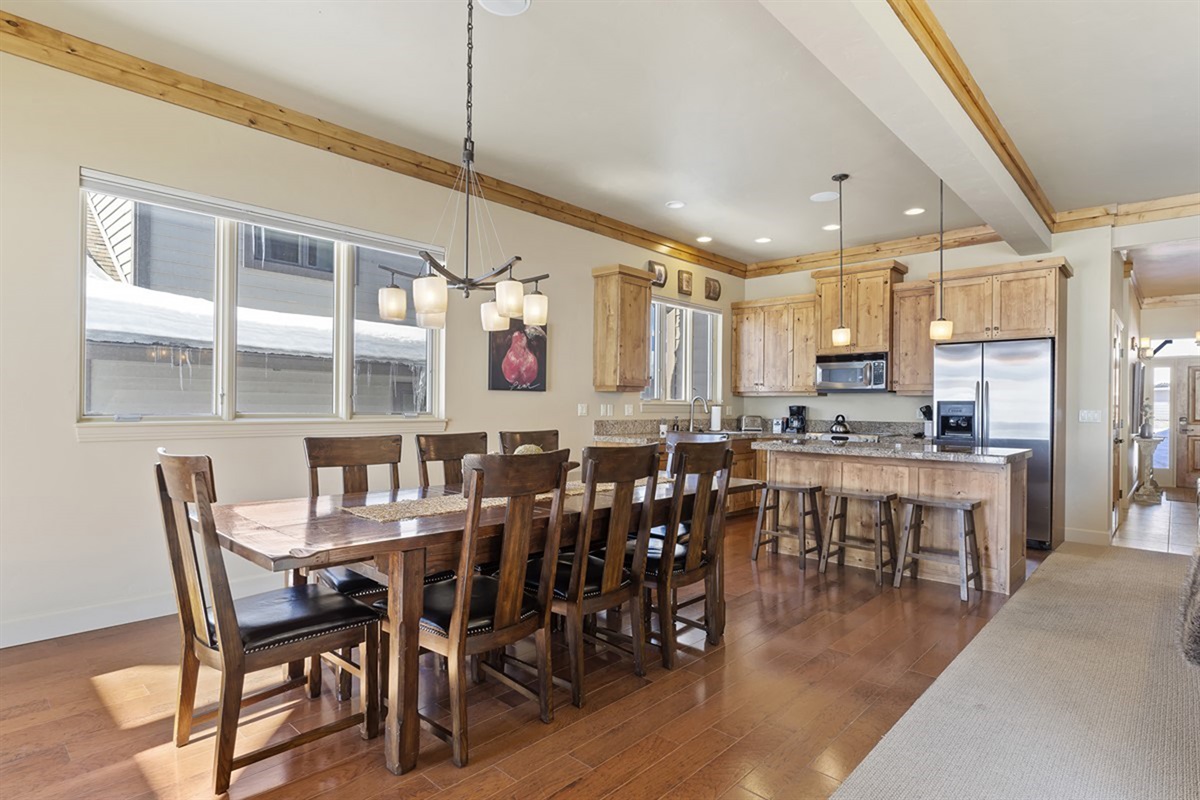 Large dining table with plenty of seating—perfect for group dinners, game nights, or morning coffee.