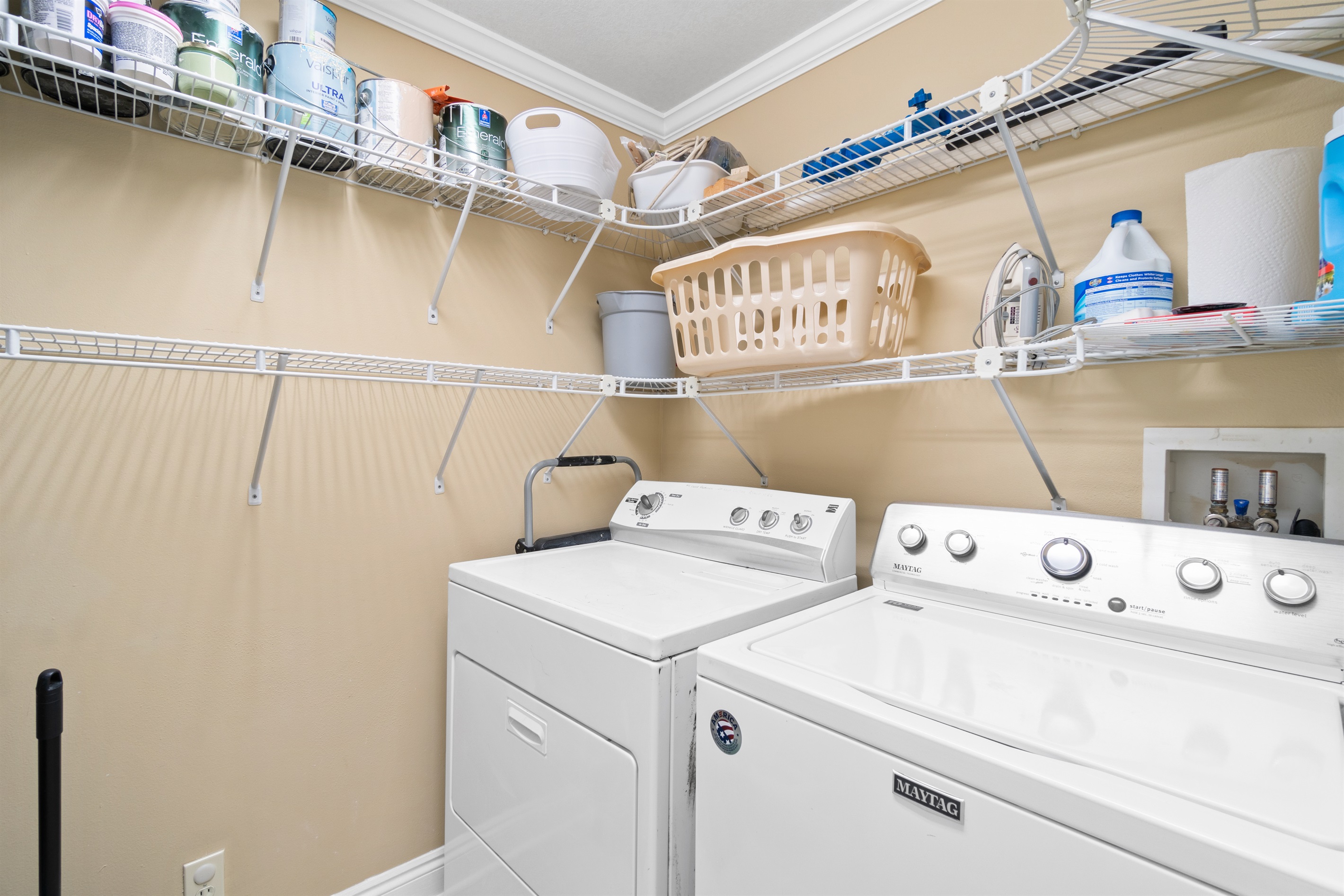Large laundry room with full size washer and dryer