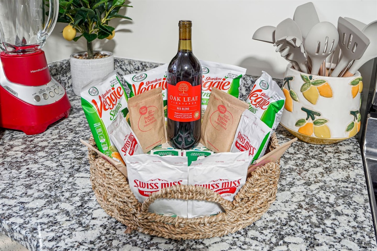 A thoughtful gift basket prepared for guests, featuring tea, coffee, and bottled water — a warm welcome to make your stay even more enjoyable.
