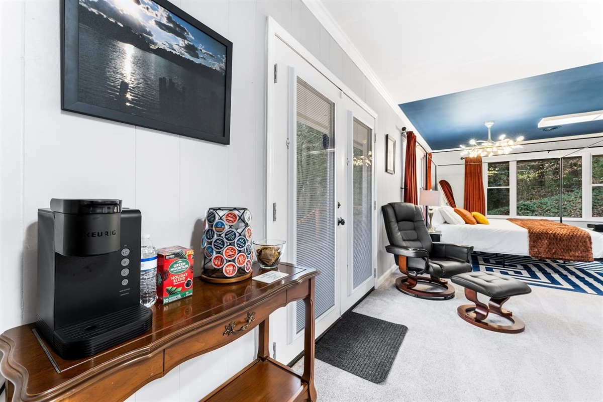 Your master bedroom includes a cozy coffee station and a door leading straight to a private patio, offering fresh air and beautiful outdoor views.