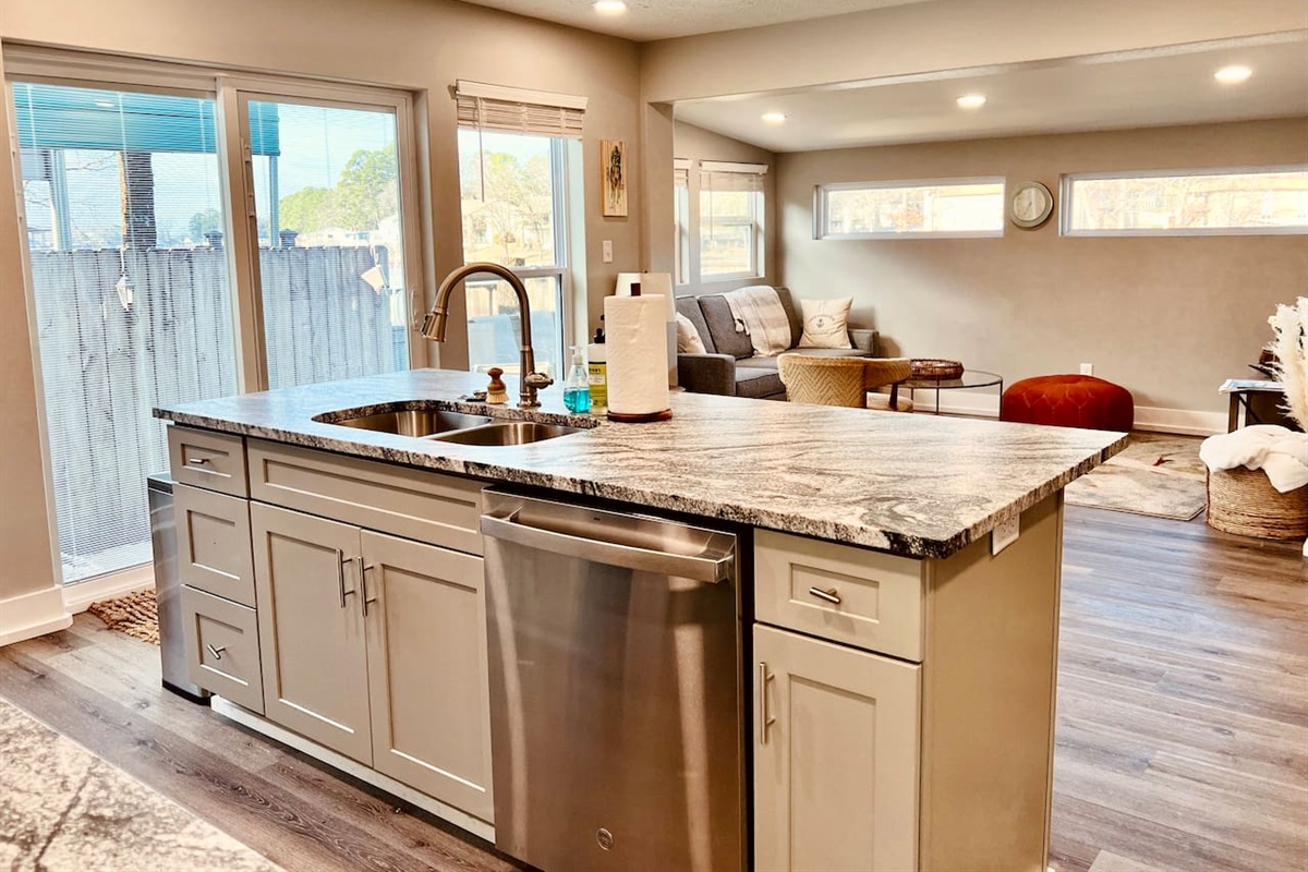 Kitchen: Bright and inviting space with sleek granite countertops and modern appliances!