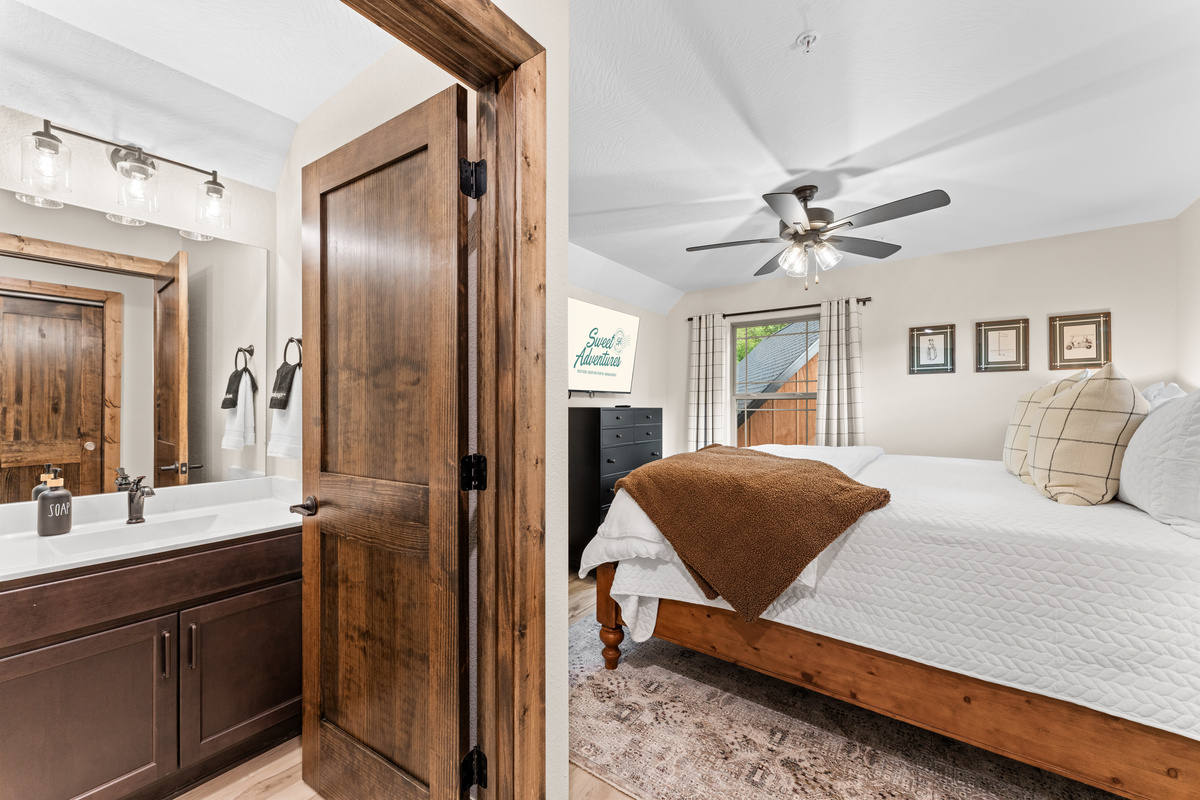 The primary bedroom upstairs has a luxury king bed and attached private ensuite bathroom