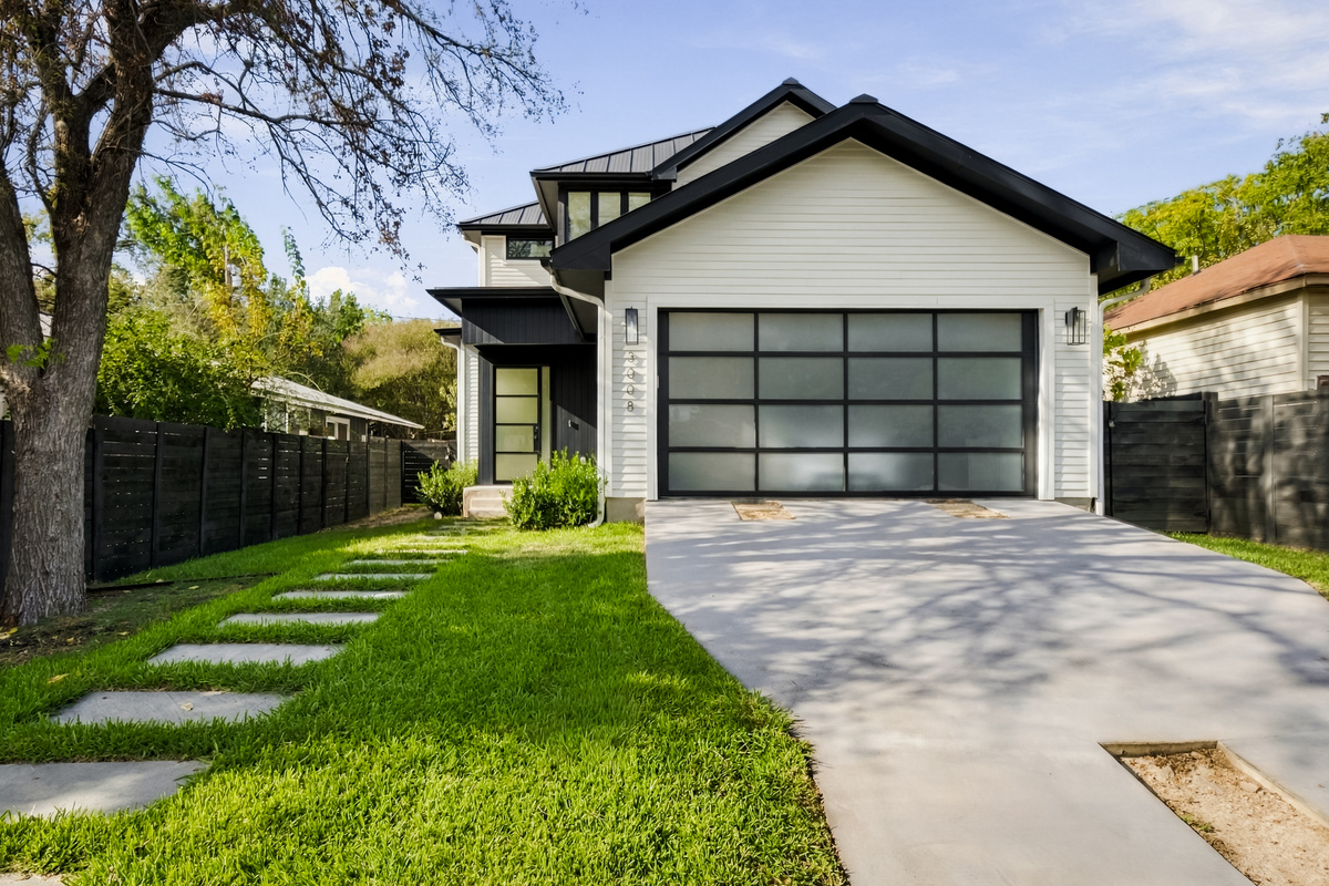 Clean curb appeal — stone walkway leads guests straight to the front door.