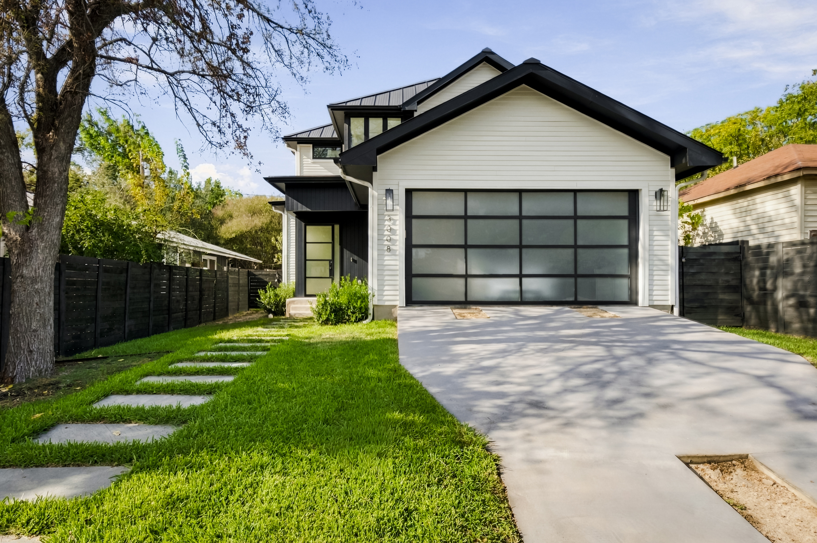 Clean curb appeal — stone walkway leads guests straight to the front door.
