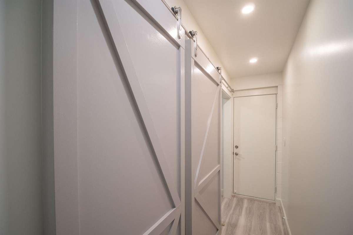 Hallway to laundry room with pantry