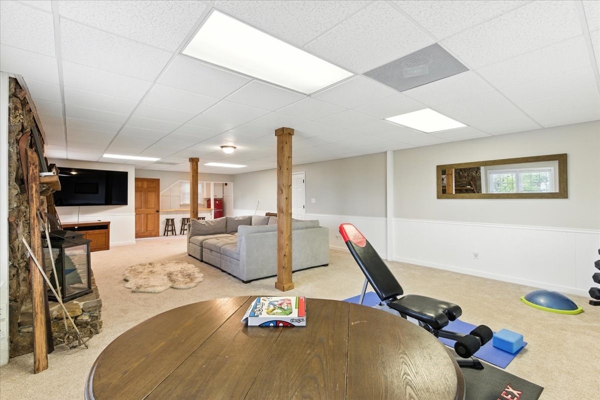 The basement offers a spacious place for gatherings or enjoying your personal fitness routine.
