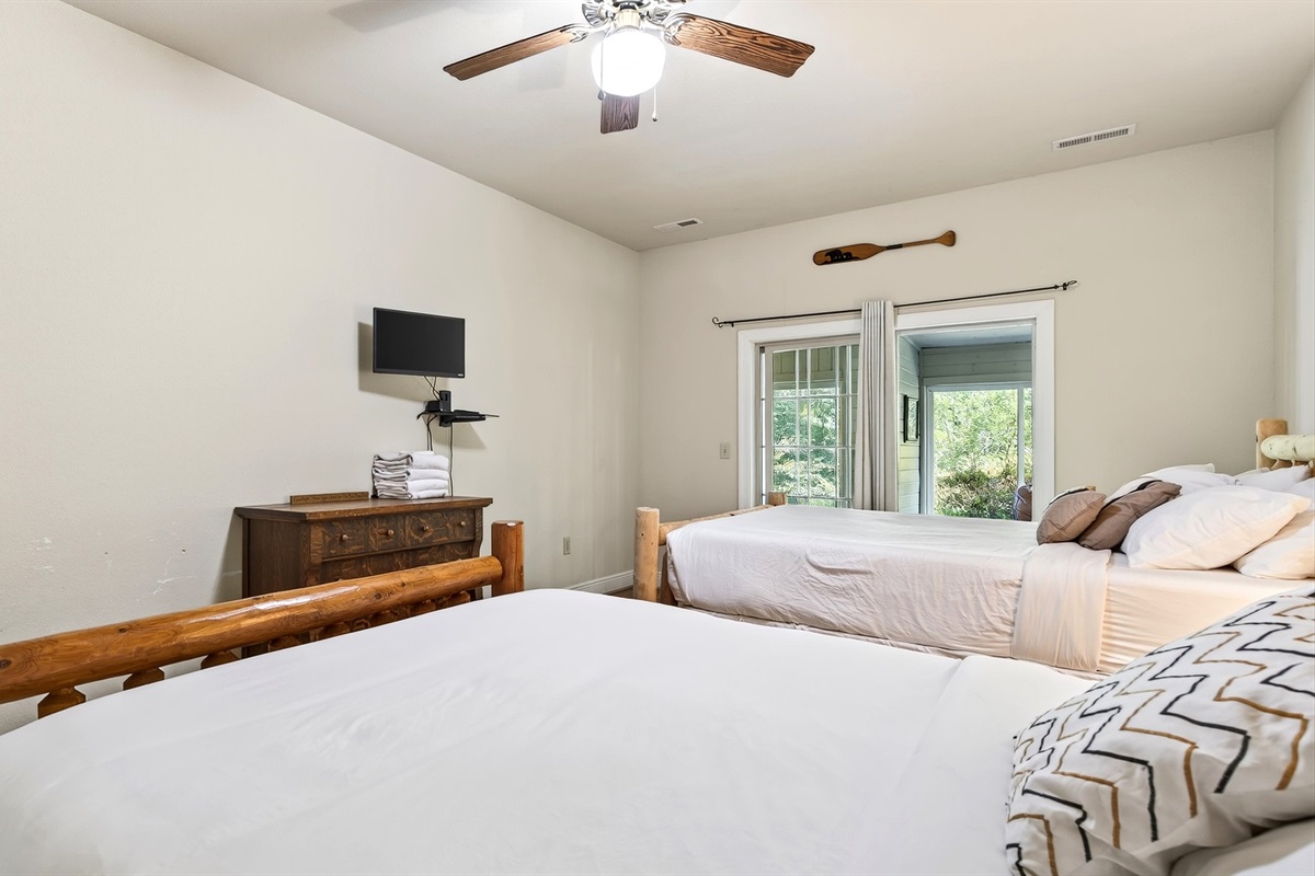 Bedroom 2 features a mounted tv