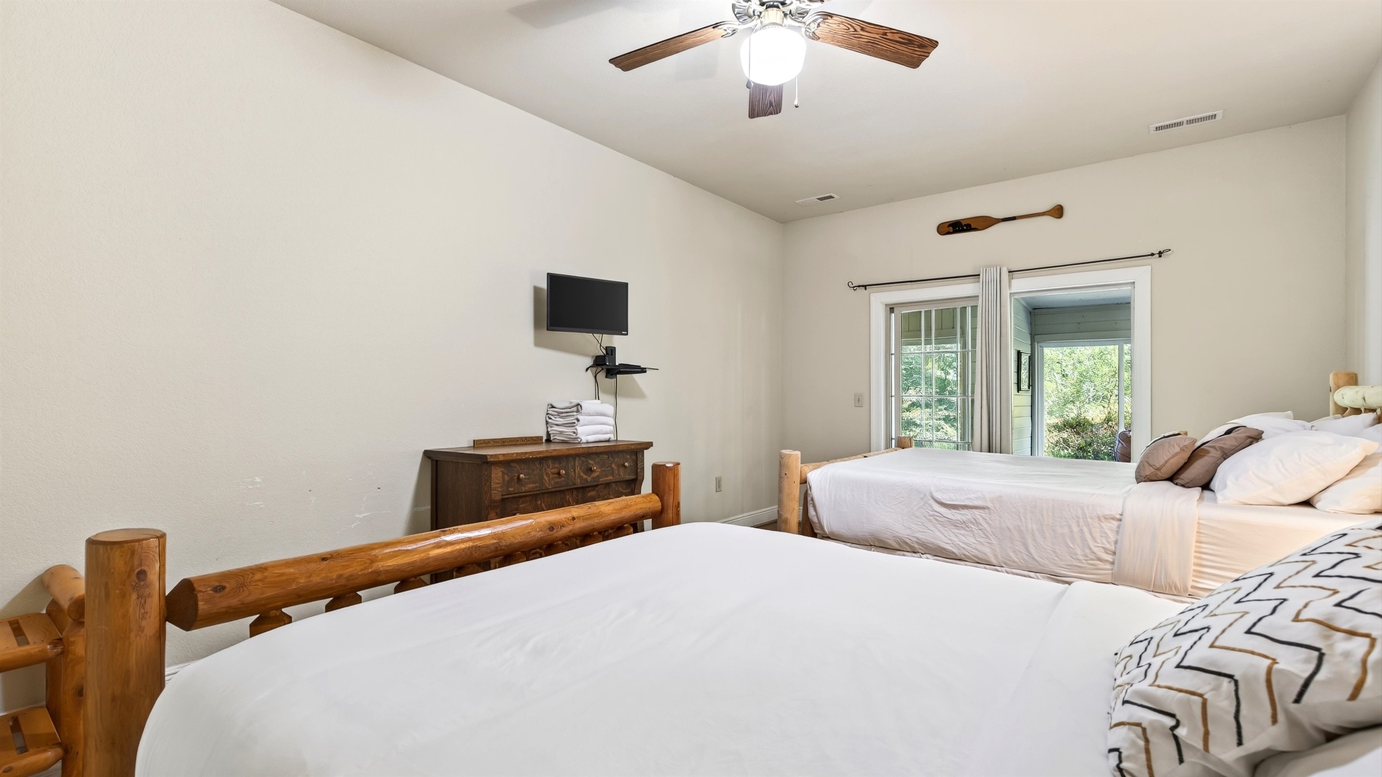 Bedroom 2 features a mounted tv
