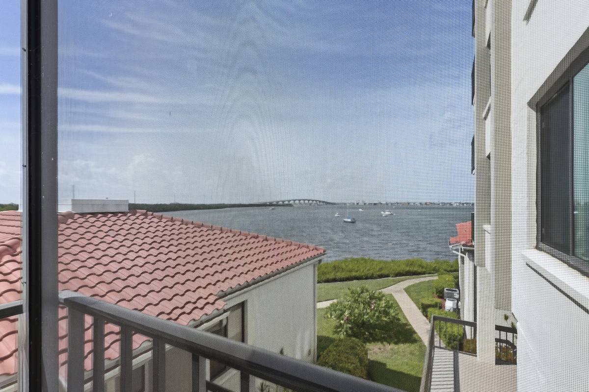 Step onto the screened-in balcony and take in peaceful waterfront views—an ideal spot for morning coffee, an evening unwind, or simply enjoying the gentle Florida breeze.