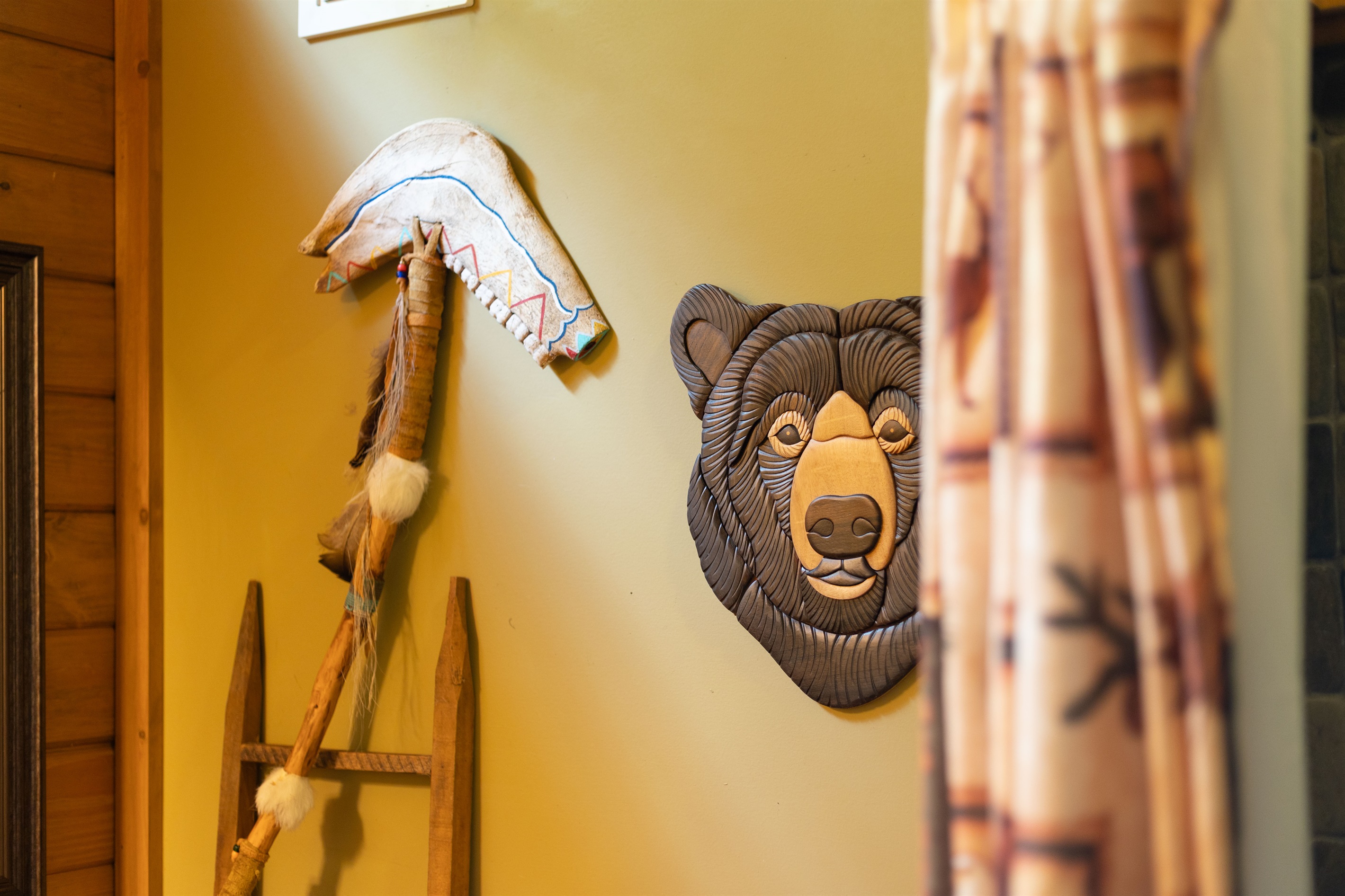 Rustic bear décor adds a fun mountain-cabin touch to the ensuite bathroom space.