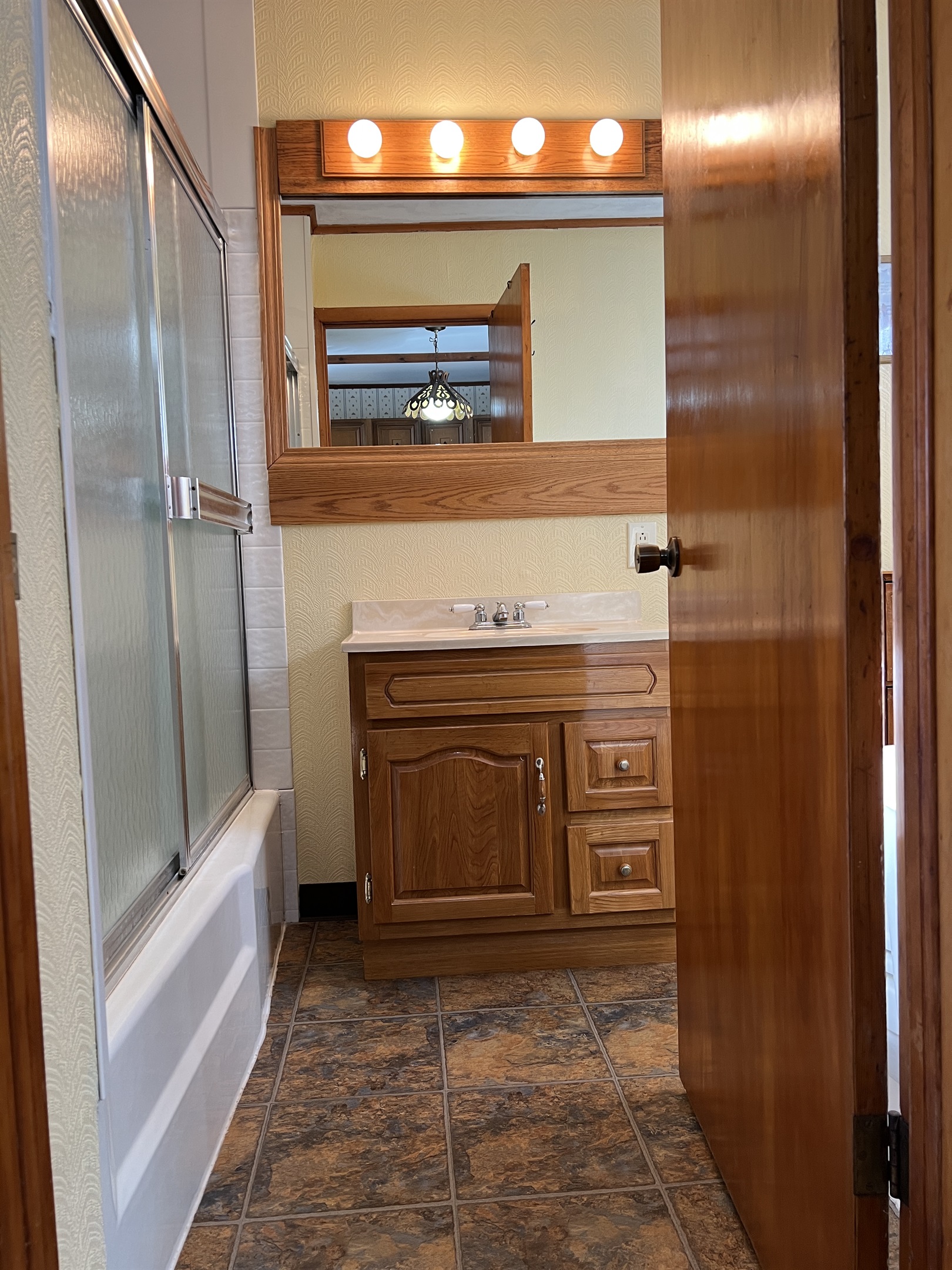 Bath with tub/shower off kitchen