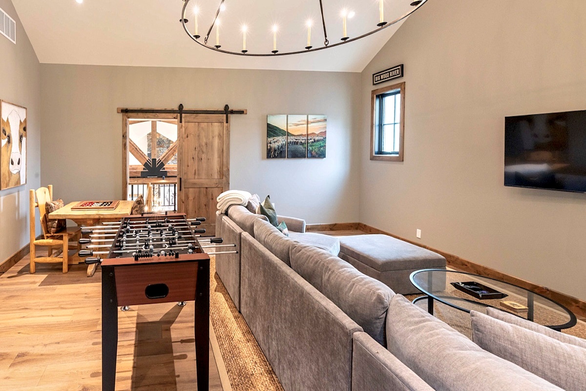 Game Room with foosball, game table, huge couch and smart TV