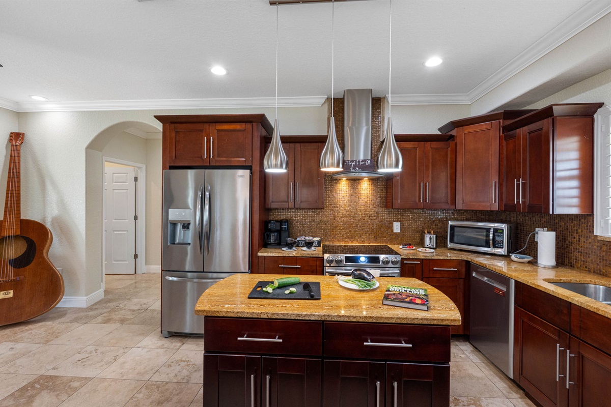 The kitchen also includes dishes, glasses, mugs, silverware, mixing bowls, cutting boards, and measuring cups—just bring your ingredients and creativity!