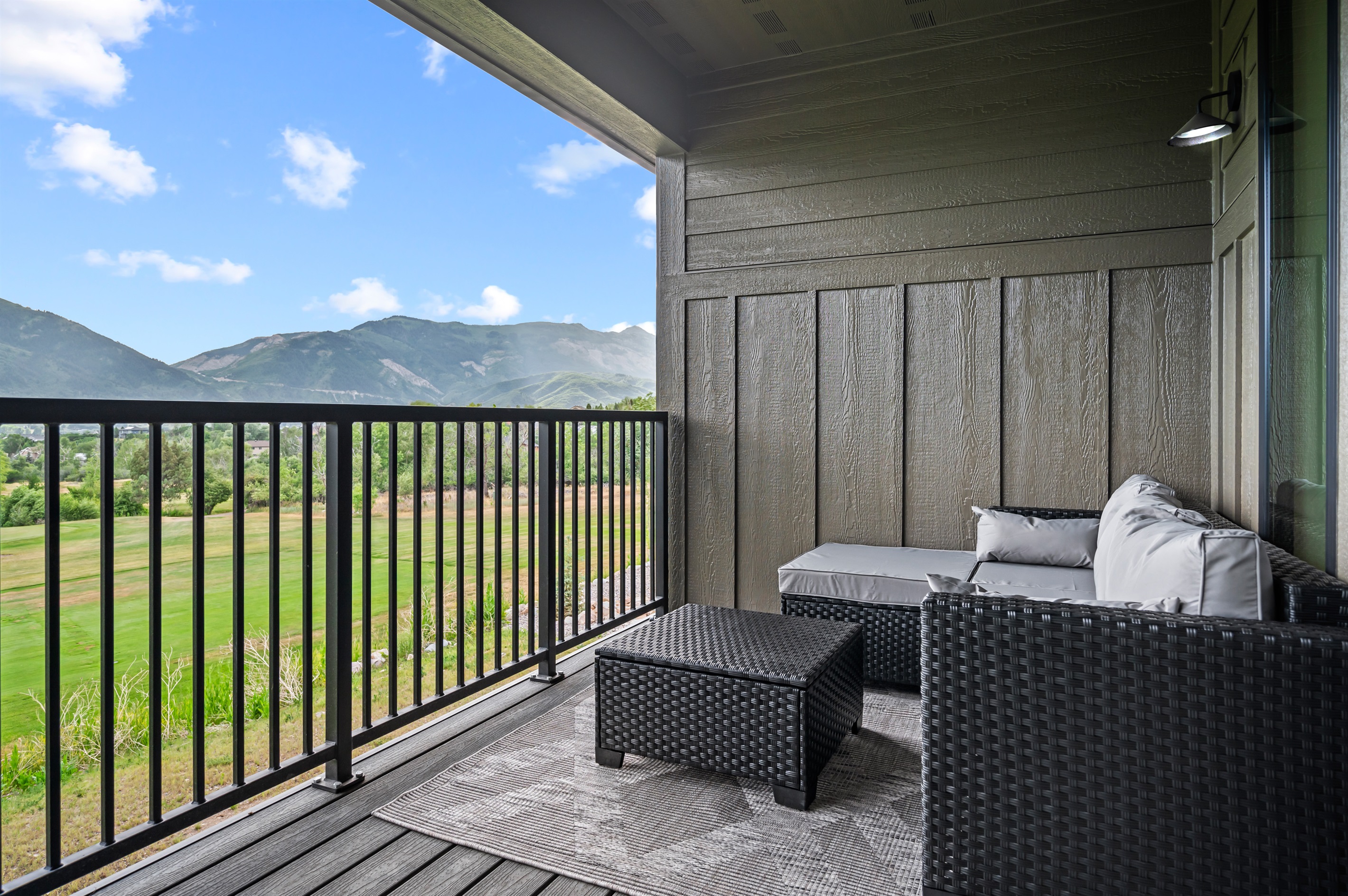 Take in sweeping views of the mountains and golf course from the comfort of your private deck.