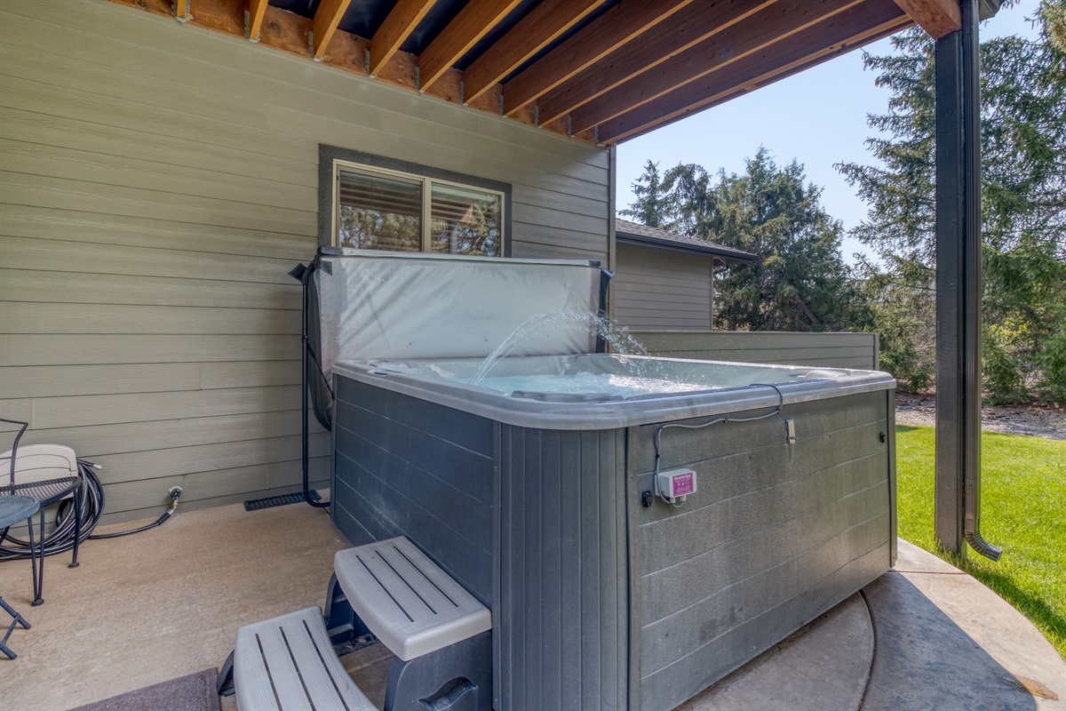 Our covered hot tub allows you to soak under the stars in all weather and enjoy the secluded spa like retreat.