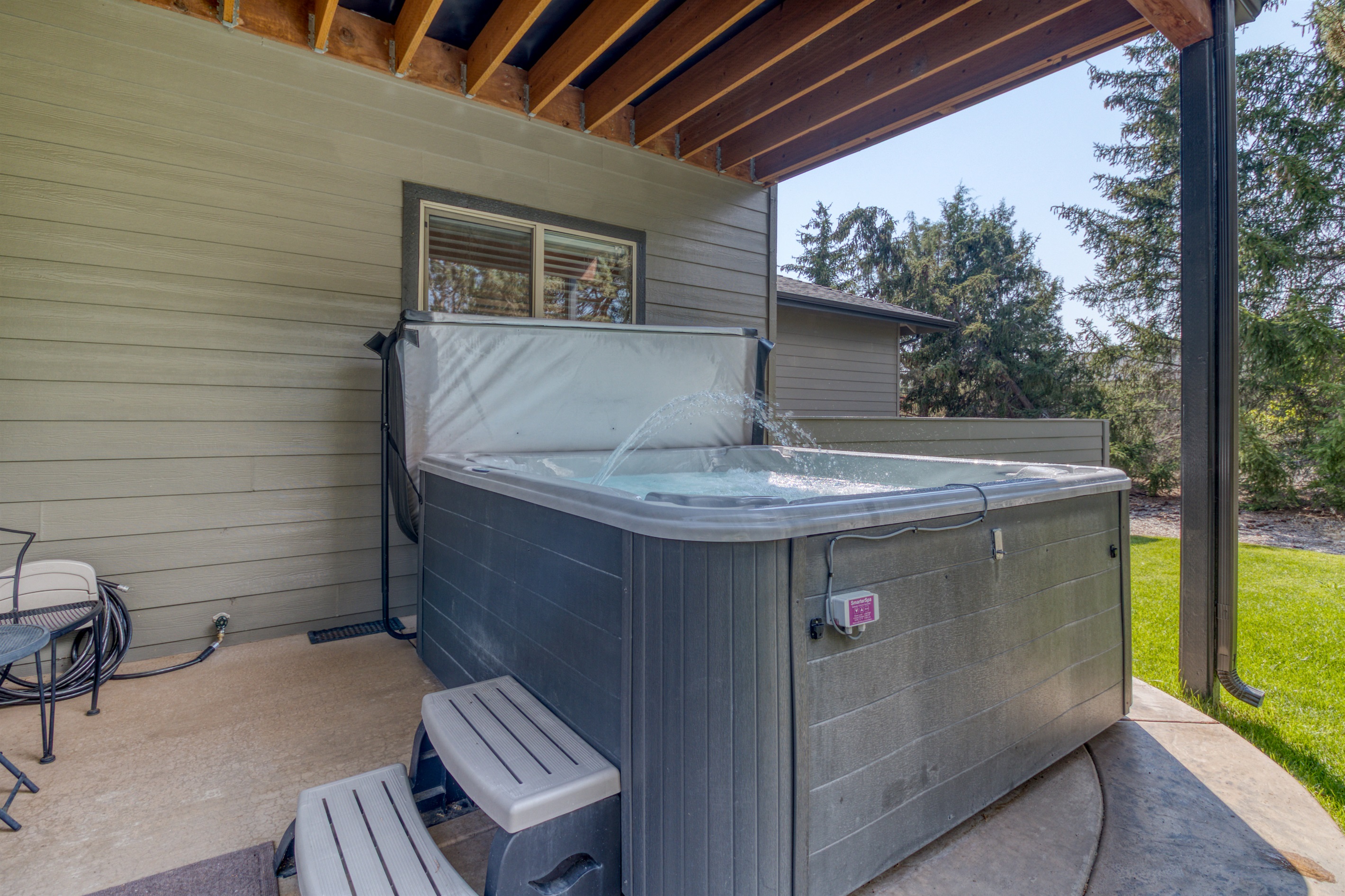 Our covered hot tub allows you to soak under the stars in all weather and enjoy the secluded spa like retreat.