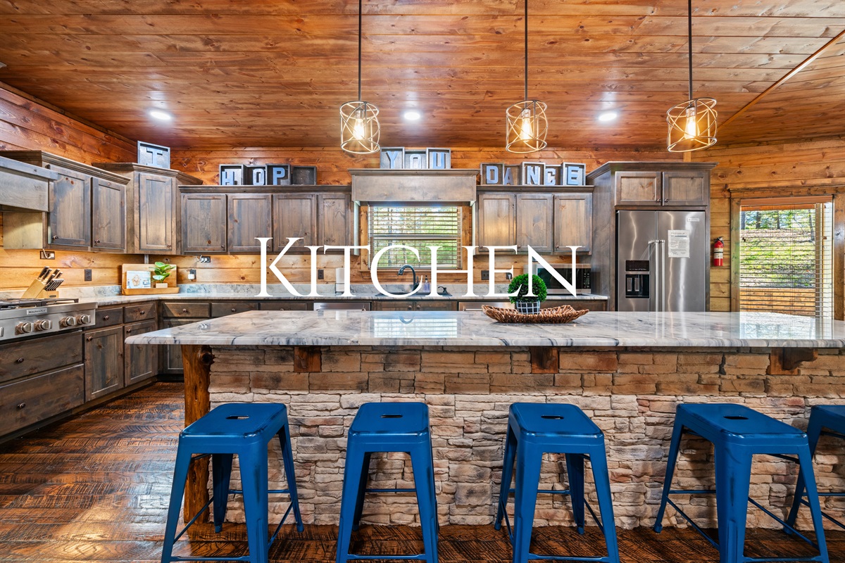 The kitchen island is the perfect gathering spot, offering bar seating and plenty of space for prepping meals or sharing a drink.