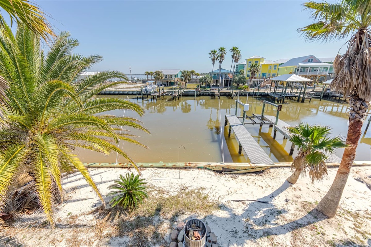Waterfront Paradise: Enjoy serene views and vibrant palm trees from your private retreat!