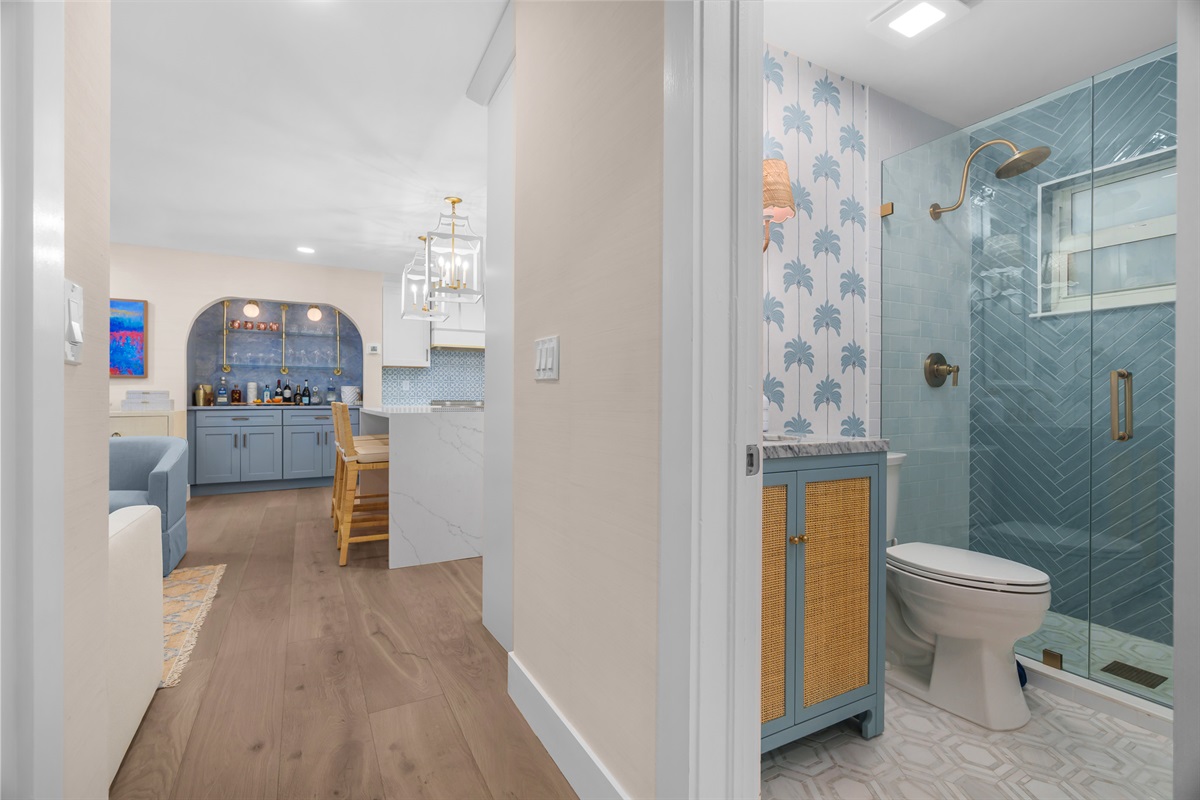 Thoughtful layout. The bathrooms are conveniently located and maintain the home's elegant coastal theme.