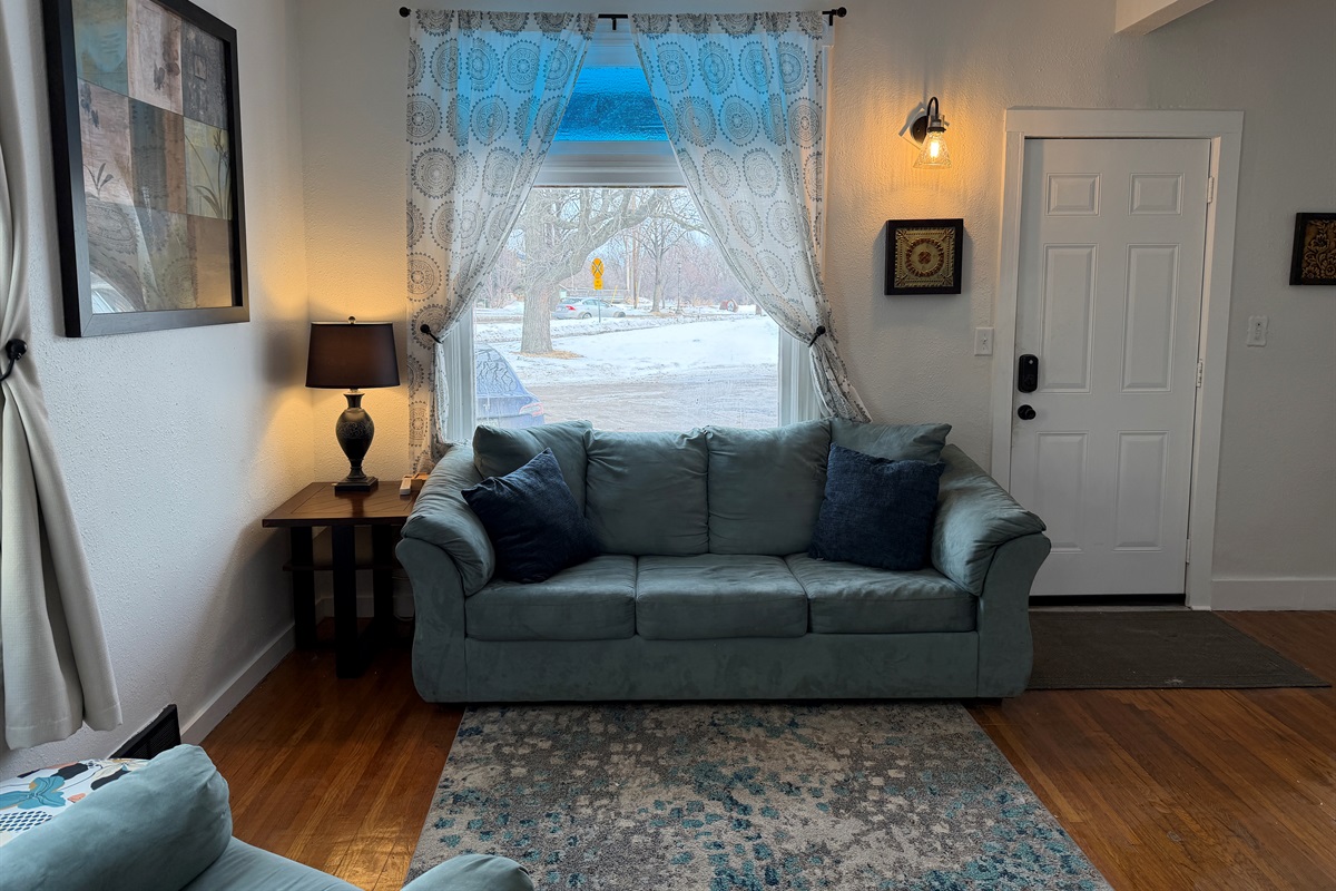 The cozy, comfy large couch accents the living room.