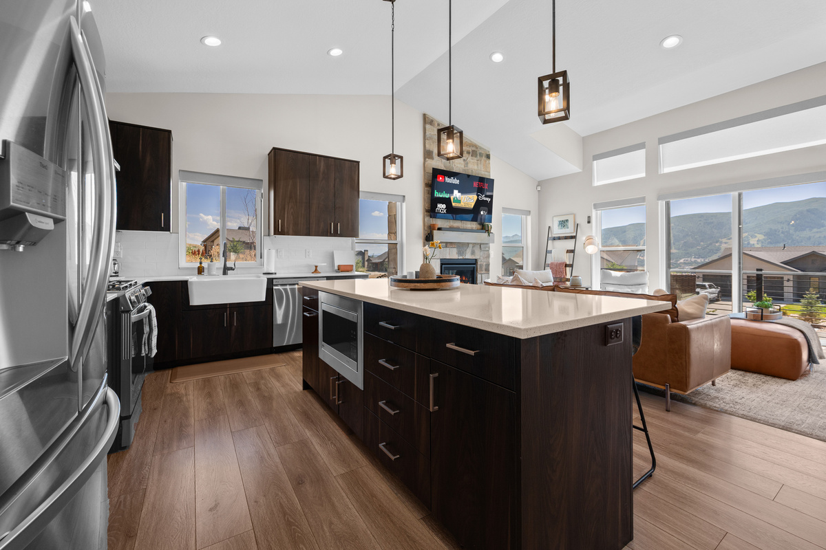 Spacious gourmet kitchen flows seamlessly into the living area, making meals and entertaining effortless.