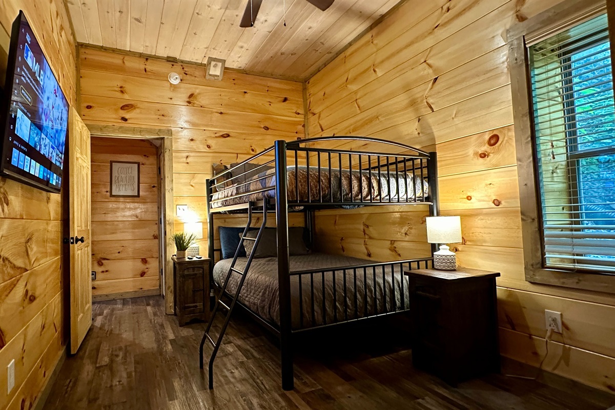 Lower level Full bedroom with attached bathroom. Indoor heated pool is on this level just behind a locked door.