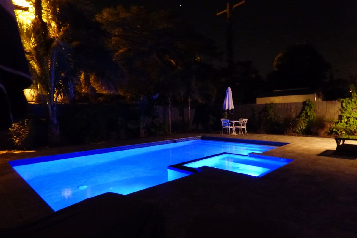 Enjoy a lovely evening by the beautifully lit pool!