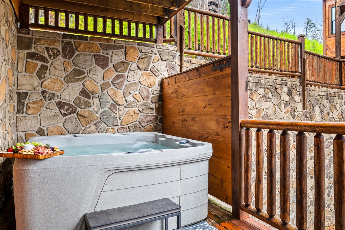 The downstairs hot tub (near Bedroom 6) fits 7 people.