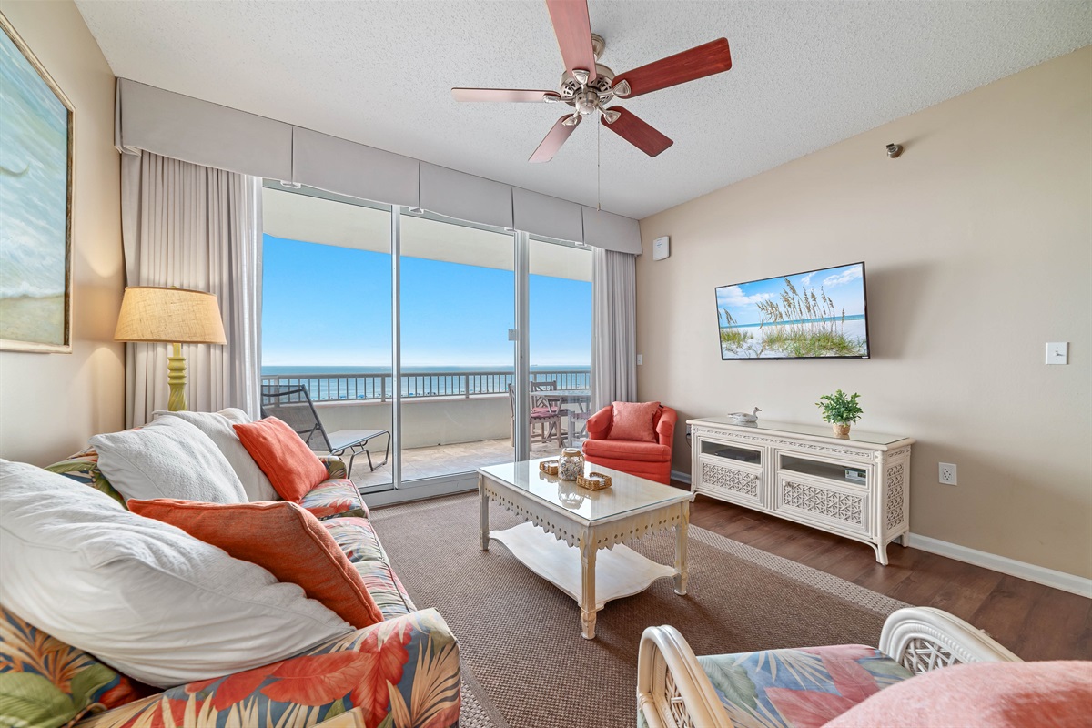 Experience the beauty of indoor-outdoor living with expansive sliding doors leading to a private balcony overlooking the ocean.