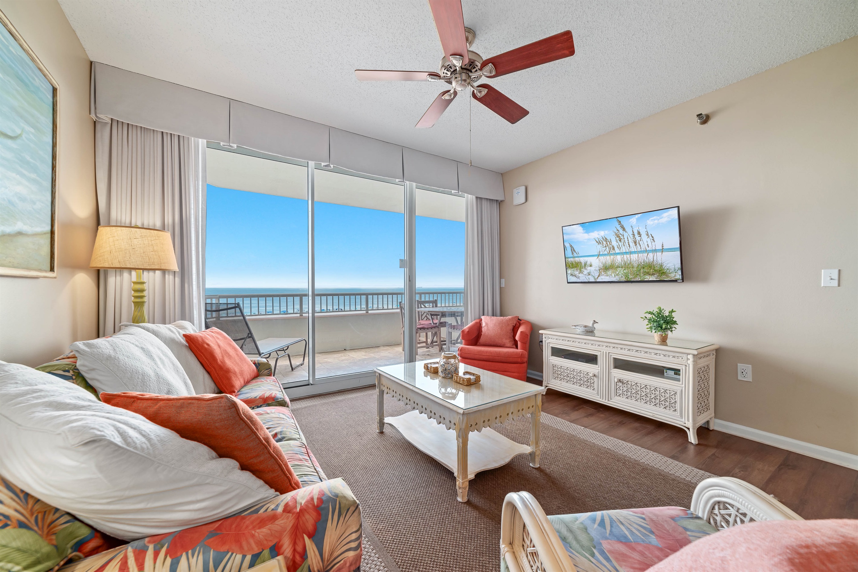 Experience the beauty of indoor-outdoor living with expansive sliding doors leading to a private balcony overlooking the ocean.