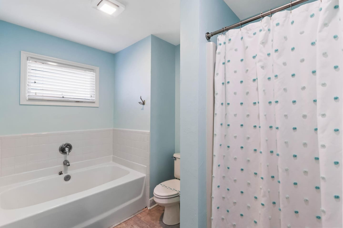 Find The garden tub and separate shower in the master bath mean everyone gets what they want after a long beach day &mdash; no waiting, no compromising.