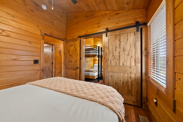 Rustic Sliding Barn Doors Leading to Connected Double Bunk Room or Closet.