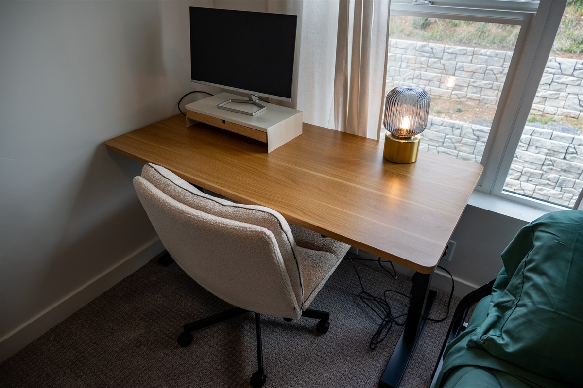 Cozy desk area for work, reading, or planning your day.