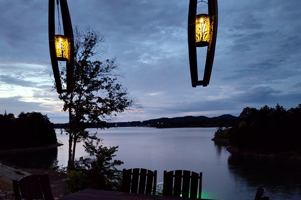 Dining table on patio overlooking lake