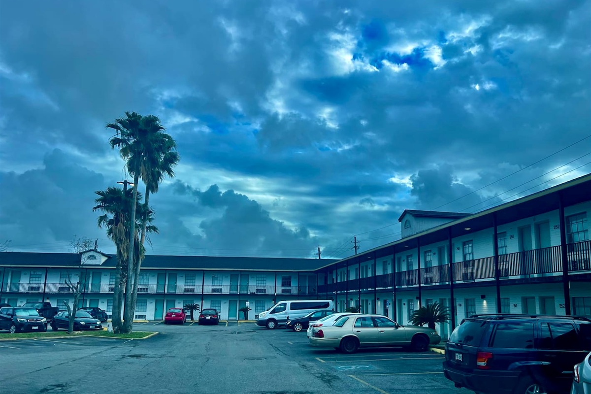 Apartment complex exterior with open parking and easy access around the property.
