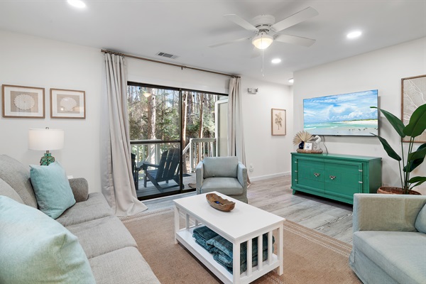 Welcoming Living Room: Step into comfort with our spacious living room, featuring plush seating and modern décor, perfect for relaxation after a sunny day at the beach.