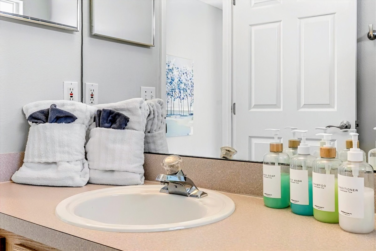 Shampoo, body wash and conditioner, as well as towels, are provided.