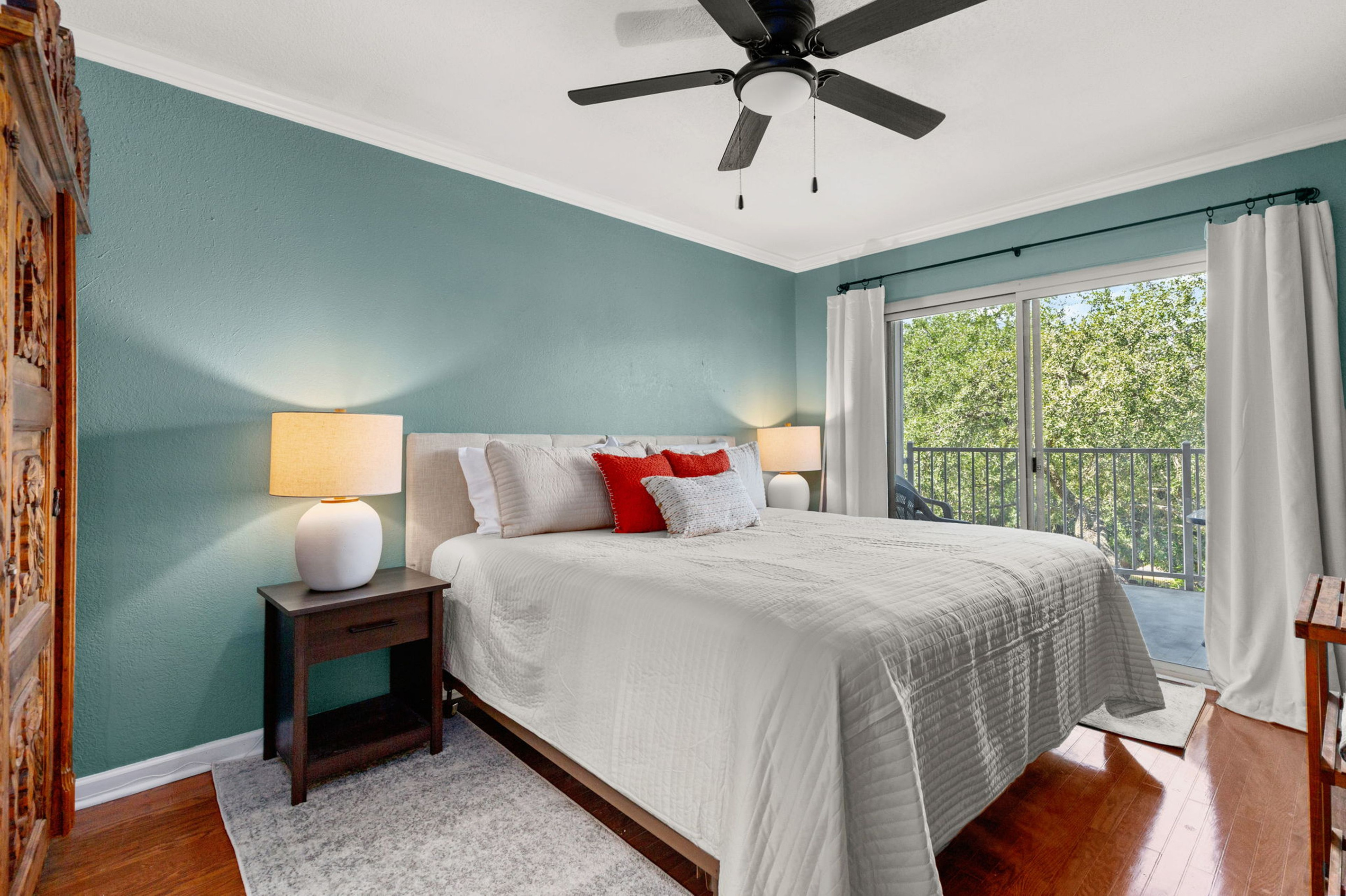 Primary bedroom with private balcony access.