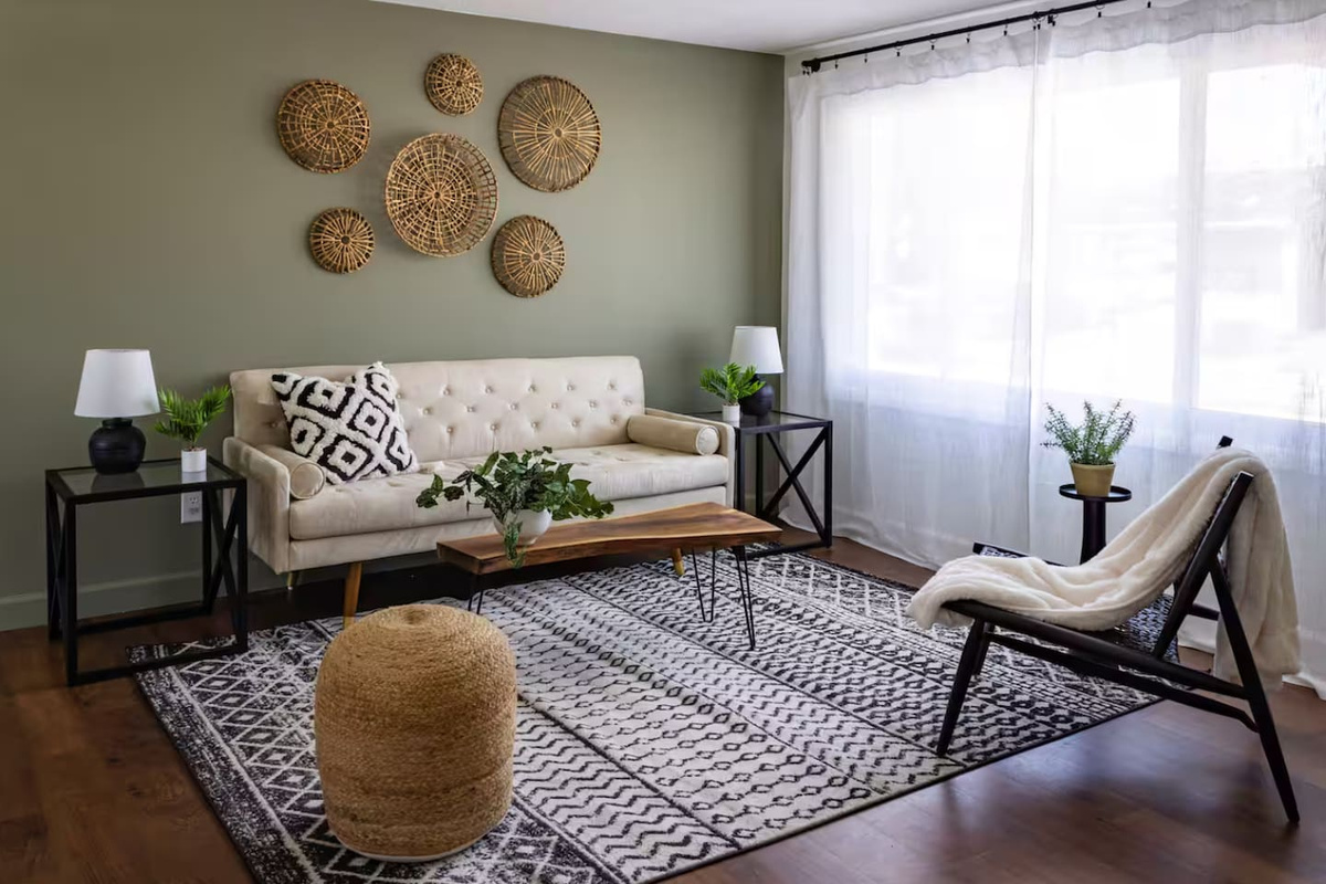 Sunlight pours in through sheer curtains, lighting up a space made for lounging.