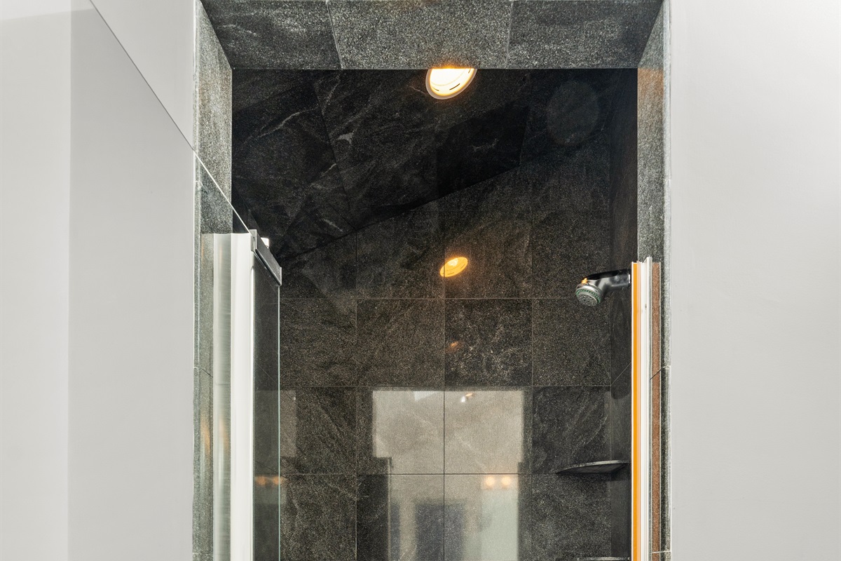 Modern ensuite with a spacious standing shower for your retreat.