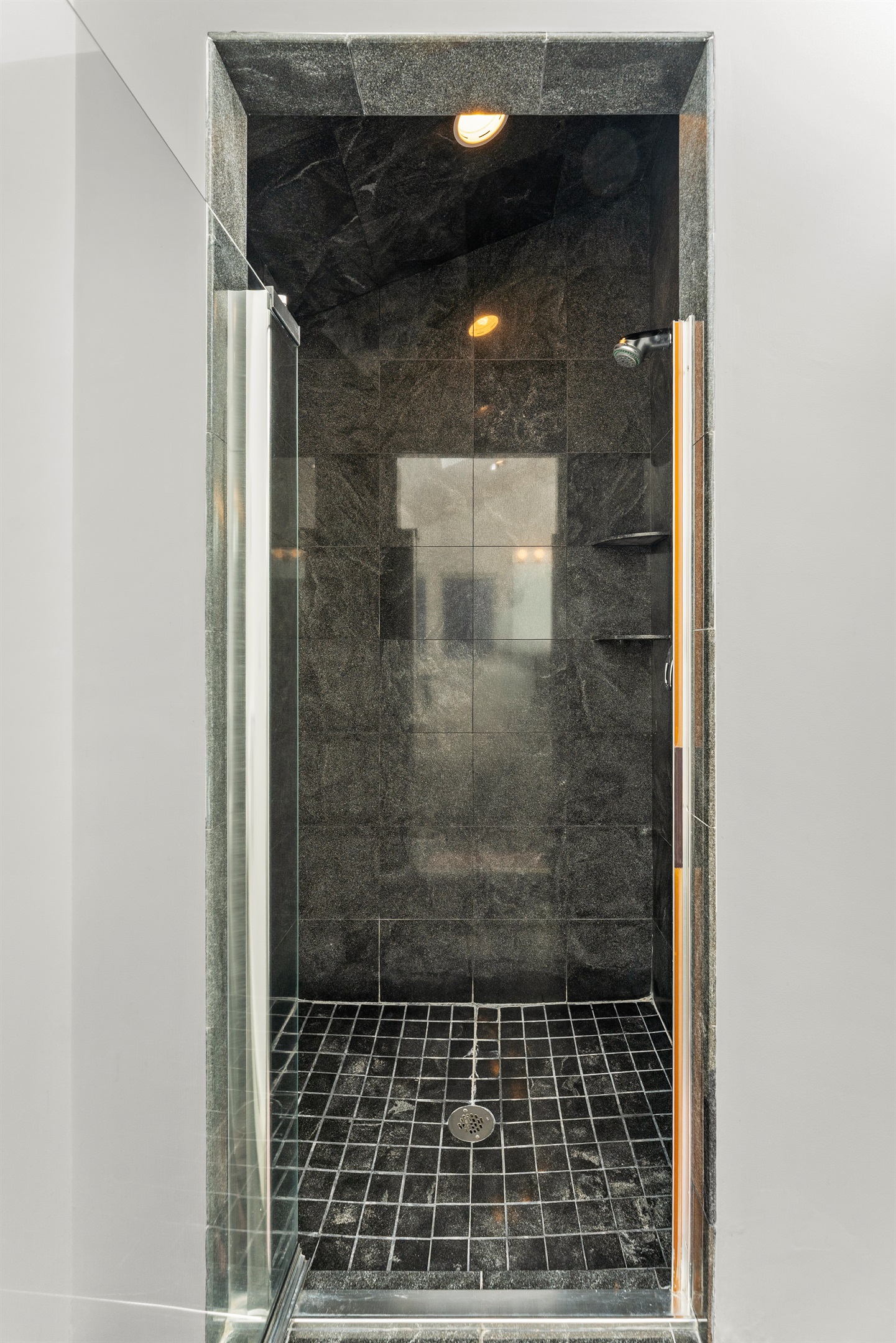 Modern ensuite with a spacious standing shower for your retreat.