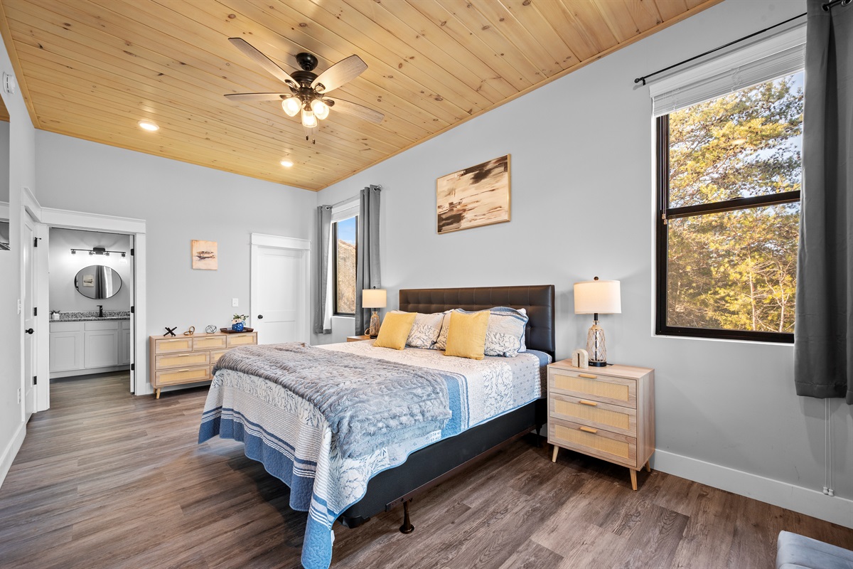 Another angle of the primary bedroom showing the attached bathroom and thoughtful layout for added privacy and convenience.