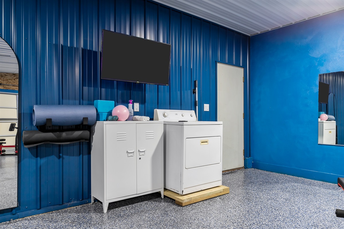 A TV is available for streaming music or following along with guided yoga sessions