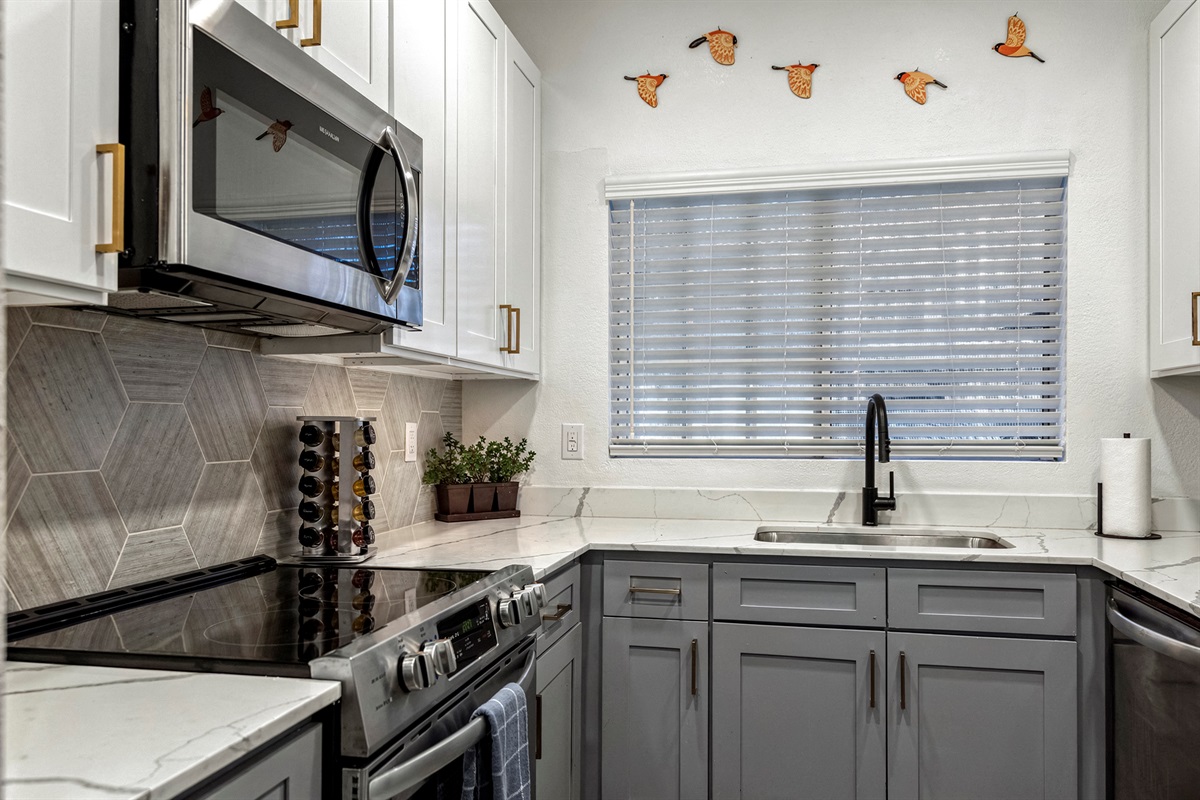 Modern and functional kitchen equipped with basic appliances and essential cooking necessities to make your stay comfortable and convenient.