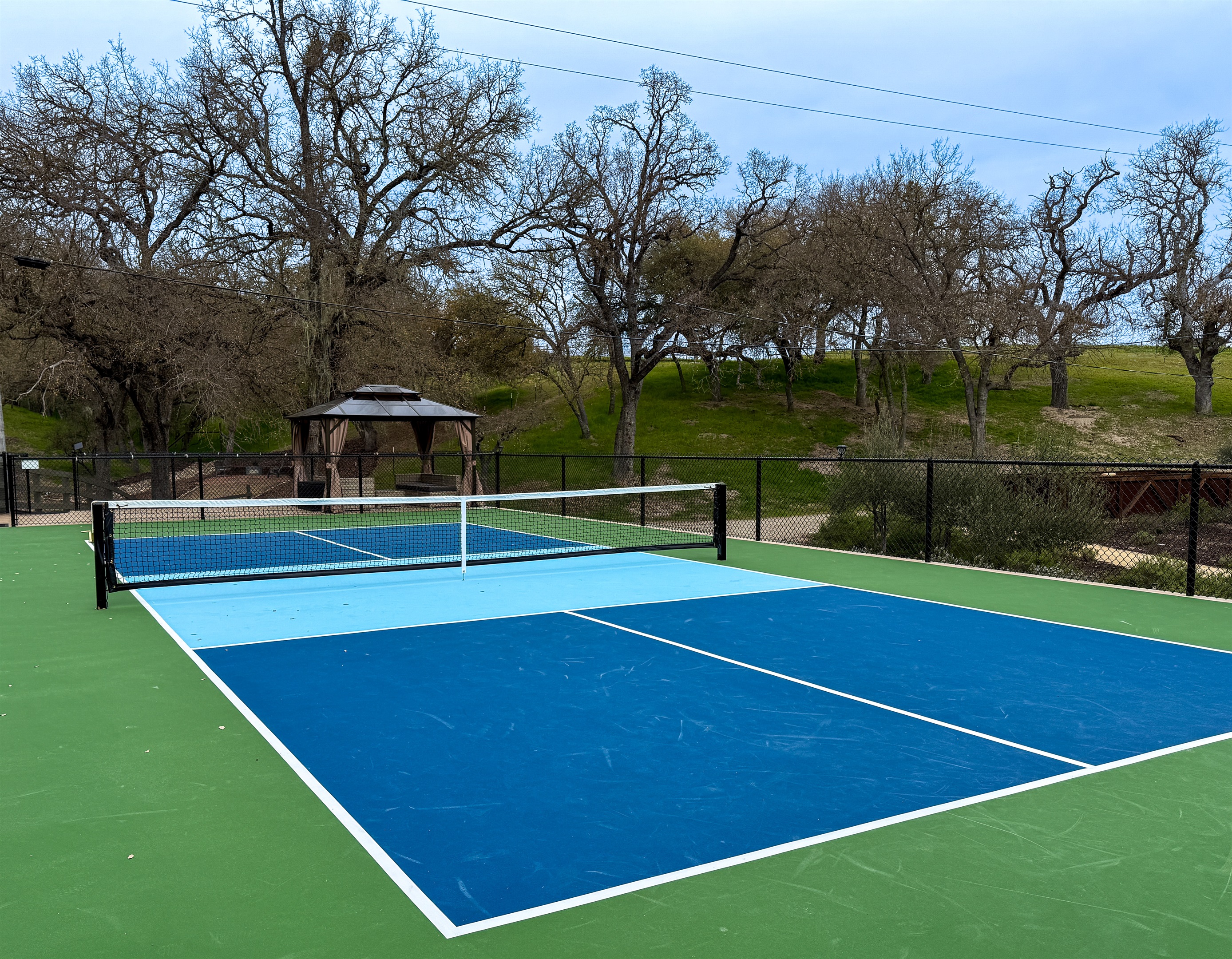 The private pickle ball court at Oaks & Madeira